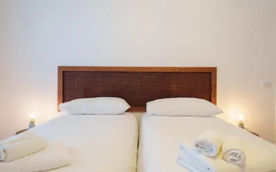 a hallway with sliding glass doors and wooden floors at Simi Roma - Carpegna in Rome