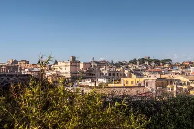 a cityscape of a city with buildings on a hill at Fabuloucity Fontana di Trevi in Rome