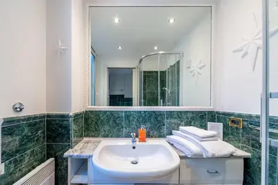 a bathroom with a sink and a mirror at Beautiful in Rome
