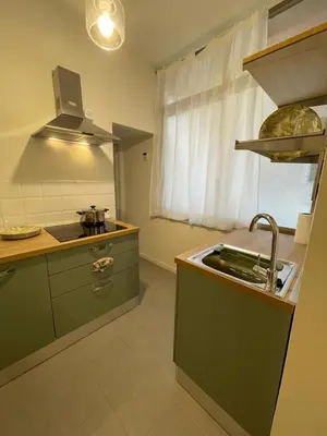 a kitchen with a sink and a sink at Enjoy Colosseo in Rome