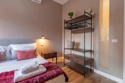 a bedroom with a bed and a book shelf at OldStation in Rome