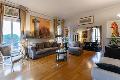 a living room with a couch and a table at Vatican Penthouse - Terrace with view in Rome