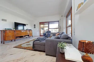 a living room with a couch and a flat screen tv at Anastasio Spacious Apartment in Rome