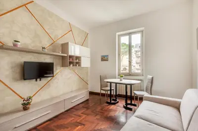 a living room with a couch and a table with a tv at Vaticano San Pietro - Marisa Home - Check-in h24 in Rome