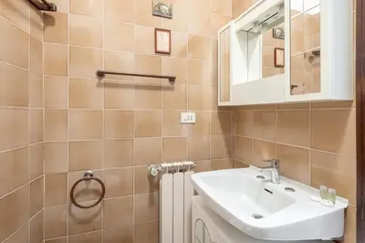 a bathroom with a sink and a mirror at Vaticano San Pietro - Marisa Home - Check-in h24 in Rome