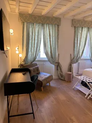 a living room with a couch and a table at Paolina Place in Rome