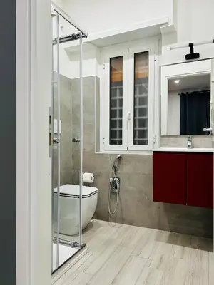 a bathroom with a shower and a toilet and a sink at Cappadocia Rooms in Rome