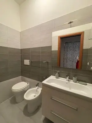 a bathroom with a toilet and a sink and a mirror at Metronio Relax in Rome