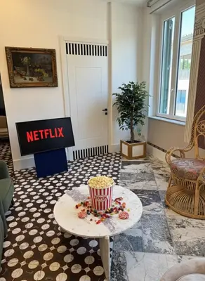 a lobby with a waiting room with a sign and popcorn at Alma at Colosseum Luxury Apartment with View in Rome