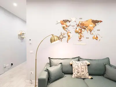 a living room with a couch and a map of the world at Rome Vatican Stay - Appartamento 2 camere da letto vicino al Vaticano in Rome