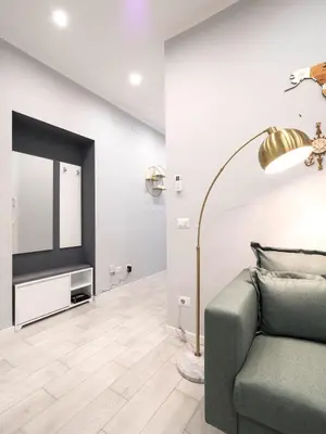 a living room with a couch and a television at Rome Vatican Stay - Appartamento 2 camere da letto vicino al Vaticano in Rome