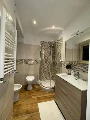 a bathroom with a shower and a toilet and a sink at Nicoletti in Rome