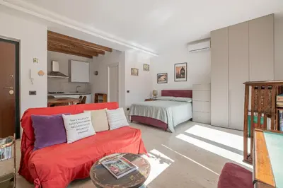 a living room with a couch and a bed at La Terrazza Loft near San Pietro in Rome