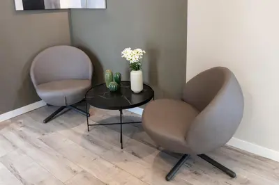 two chairs and a table in a room at Hotelleria Prestige in Rome