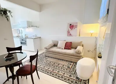 a living room with a couch and a table at Clarus apartment in Rome in Rome