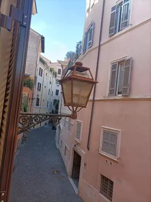 a street light attached to the side of a building at Colosseo Elegant Apartment in Rome