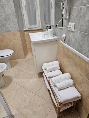a bathroom with a sink and a toilet at Apartment Maria in Monti in Rome