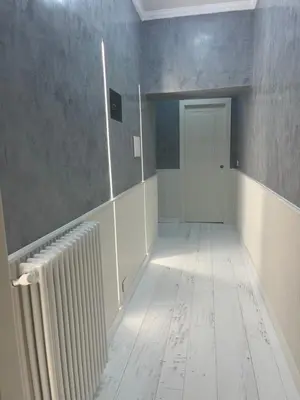 an empty room with a radiator and a door at Villafranca17 in Rome