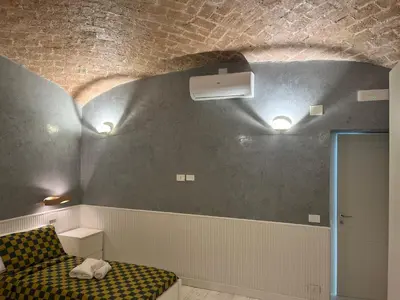 a room with a couch and a ceiling with lights at Villafranca17 in Rome