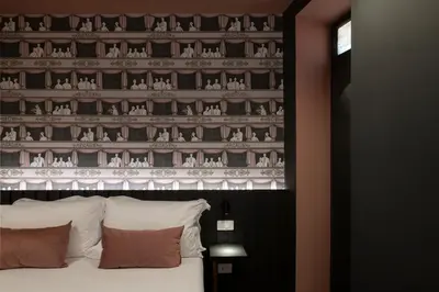 a bedroom with a large bed with a wall with animals at Colonna Collection in Rome
