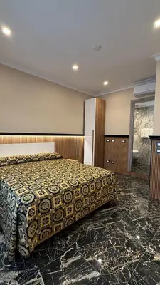 a bedroom with a large bed in a room at Bed and Breakfast Eritrea in Rome