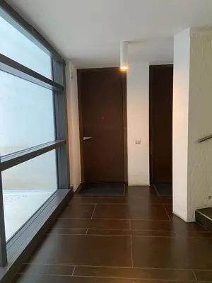 an empty hallway with a door and a window at P&P Luxury Home in Rome