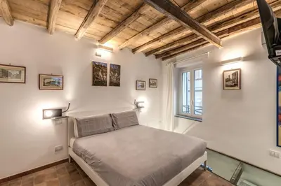 a bedroom with a bed and a window at La Casa Dei Sogni in Rome