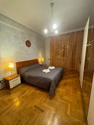 a bedroom with a bed with two towels on it at Tatyana appartament in Rome