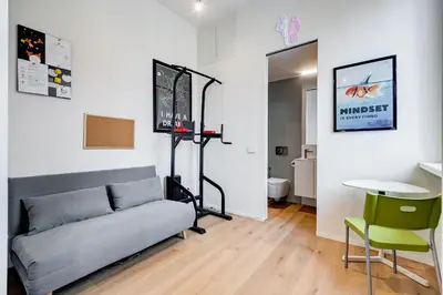 a living room with a couch and a table at Modern flat in Vatican in Rome