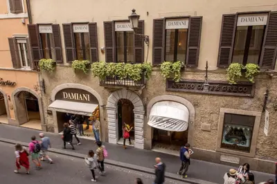 a group of people walking in front of a building at The Inn at the Spanish Steps Elegant Collection - GioielloJewel in Rome