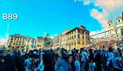 a large crowd of people walking in a city at B89 Luxury Gallery House Piazza Di Spagna in Rome