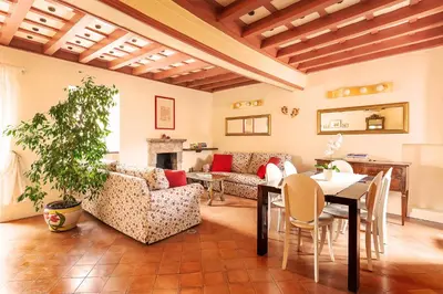a living room with a table and chairs at Principessa Trevi in Rome