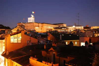 a view of a city at night with buildings at Principessa Trevi in Rome