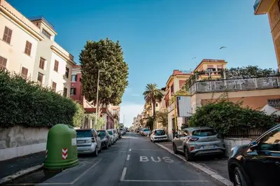 a street with cars parked on the side of the road at Vatican Suite 