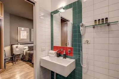 a bathroom with a sink and a shower at Interno5 in Rome