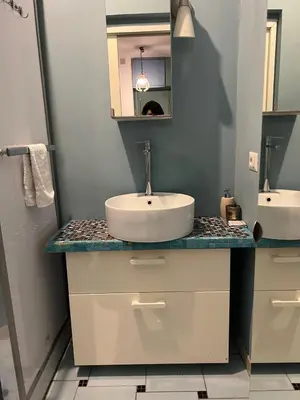 a bathroom with a sink and a mirror at Cozy Studio near Vaticano in Rome