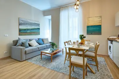 a living room with a couch and a table at Vatican Lante Apartment in Rome