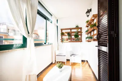 a room with a window and a table and chairs at Boutique Trastevere Rome apartment Ripa 12 in Rome
