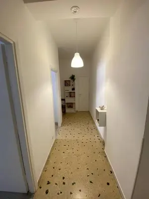 an empty hallway with a white room with a hallwayngth at Armandino's sweet home Roma in Rome