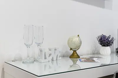 a table with wine glasses and a globe on it at Giardinetto 14 in Rome
