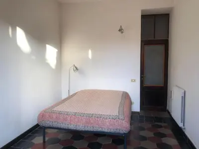 a bedroom with a bed in a room at Boschetto Apartment in Rome