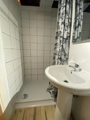 a bathroom with a sink and a shower at La casetta ai fori imperiali in Rome