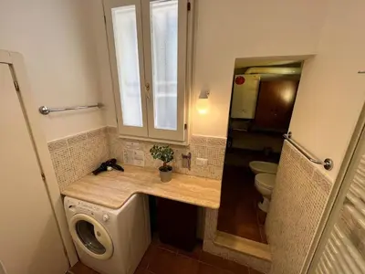 a bathroom with a sink and a toilet at Campo dei fiori - cozy and central apt in Rome