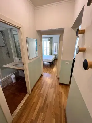 a hallway of a room with a bathroom at Campo dei fiori - cozy and central apt in Rome