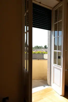 an open door with a view of a balcony at Moon Cove, Villa Borghese Prestige Hideaway Rome in Rome