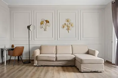 a white living room with a couch and a table at Maison G - new design apartment with balcony in Rome