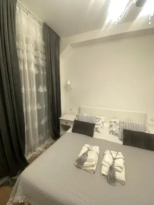 a bedroom with a bed with towels on it at Colosseo luxury home in Rome