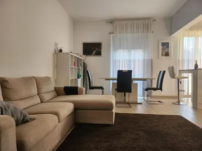 a living room with a couch and a table at P7 Casa Roma in Rome