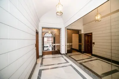 a hallway with a tile floor and a building at Enjoy Colosseum Apartment in Rome