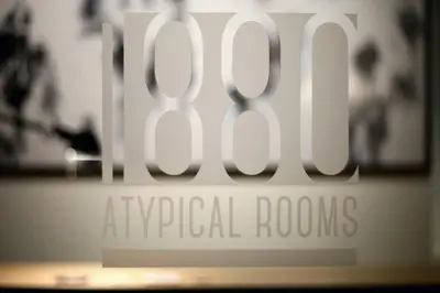a sign for the airport royal rooms at Atypical Rooms in Rome